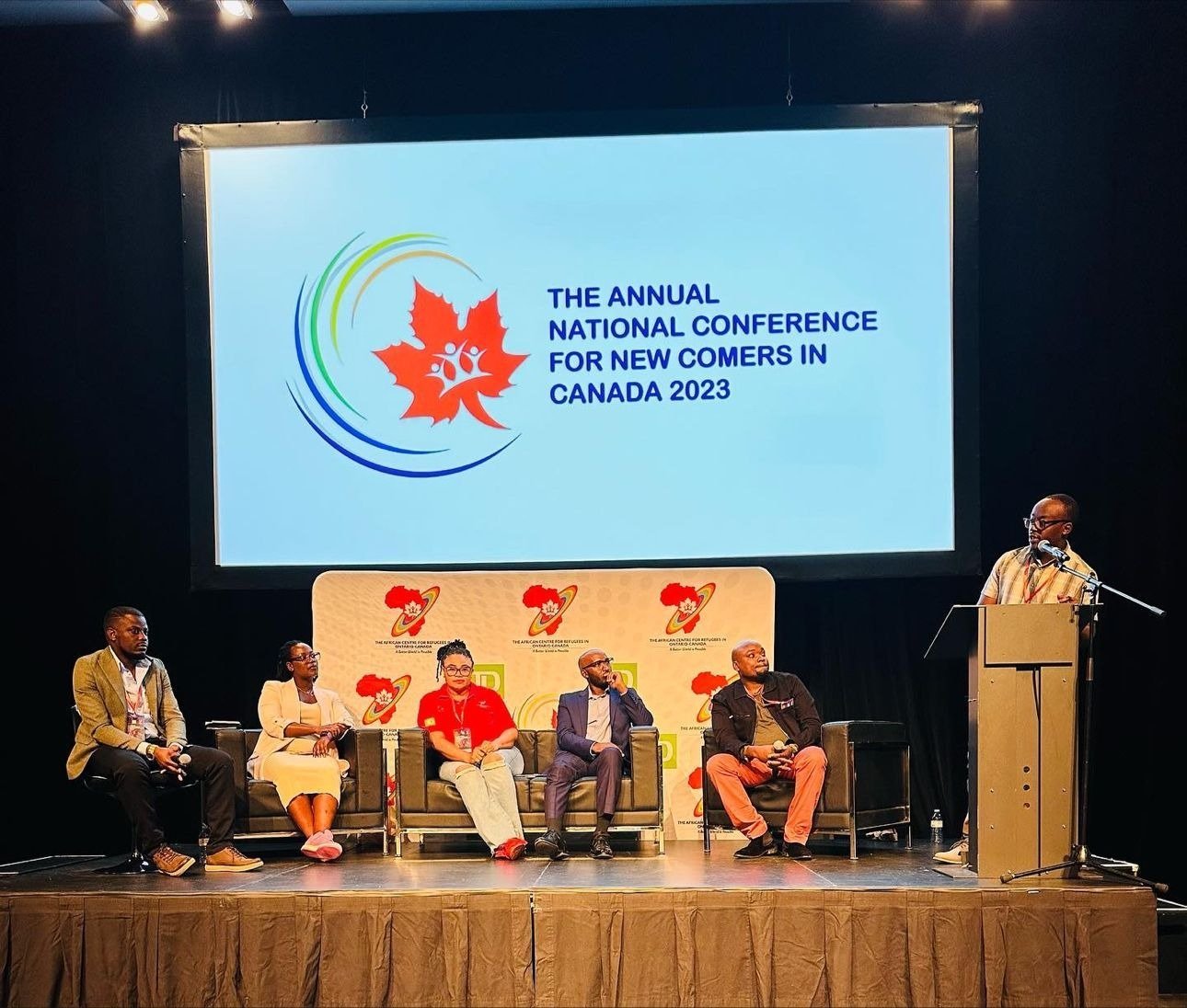 Alex Ahabwe speaking at the Annual National Conference for Newcomers in Canada